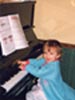 [Lucy at the piano - 1999]